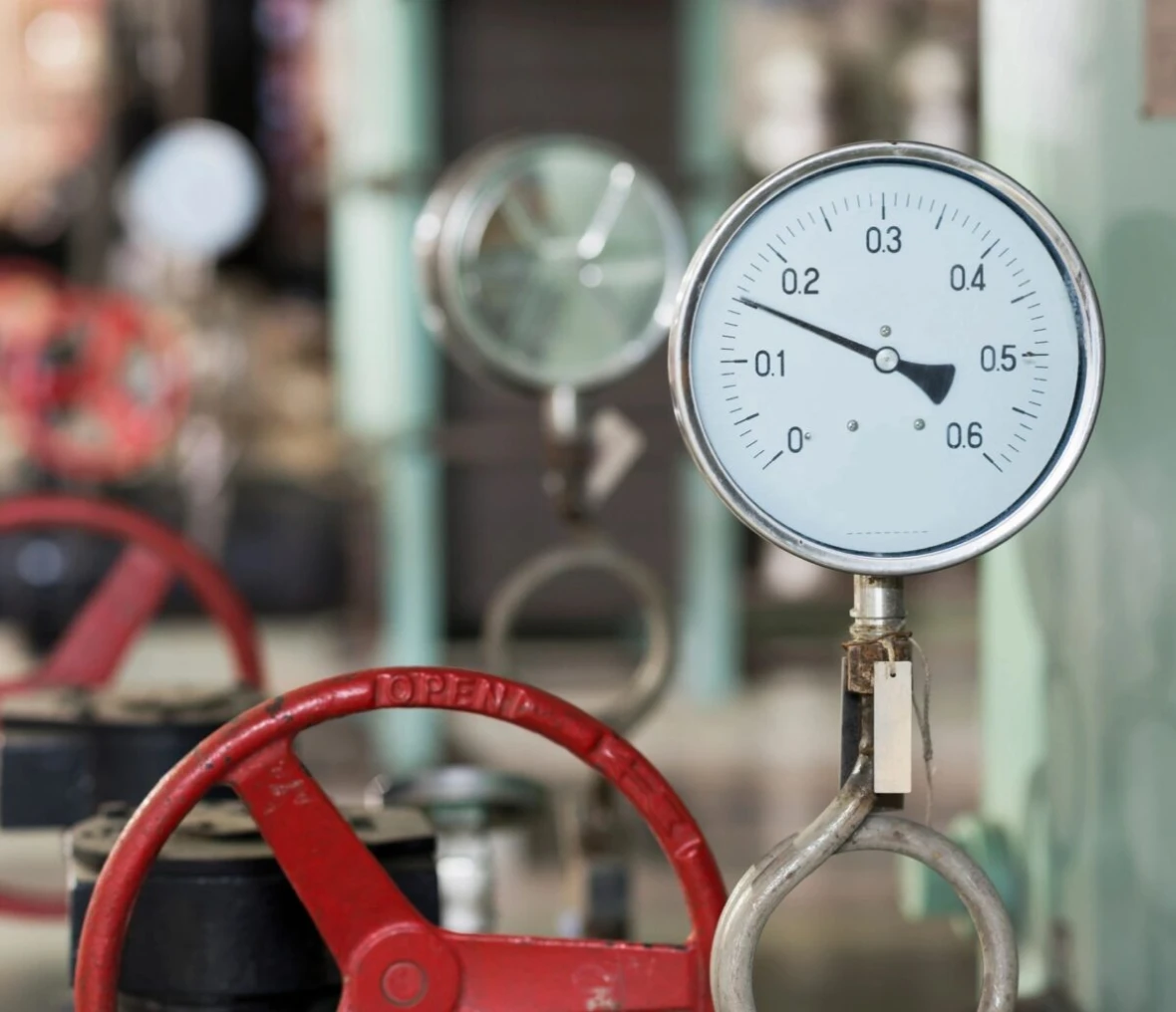 Industrial pressure gauge with red valve